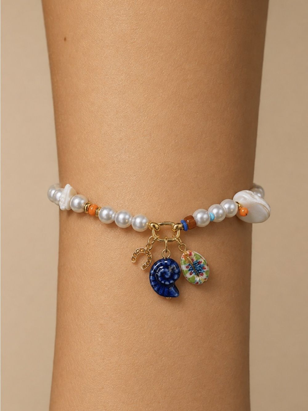 MAYAMAR White Pearl Beaded Bracelet with Blue and Multicolor Shell Charms 7”